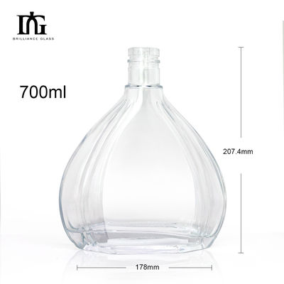 Botella redonda transparente de 700 ml de 750 ml de vidrio de vodka, whisky y ron con tapa de tornillo y muestra