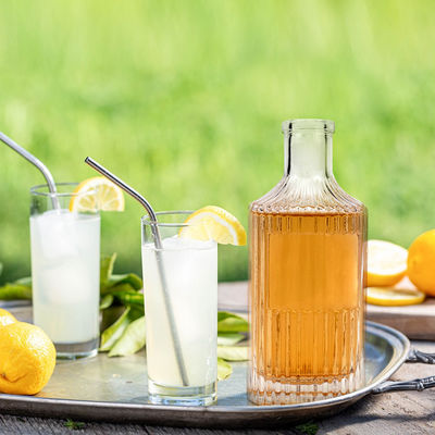 OEM/ODM aceptable Botella de licor de 750 ml clara con manipulación de impresión por pulverización