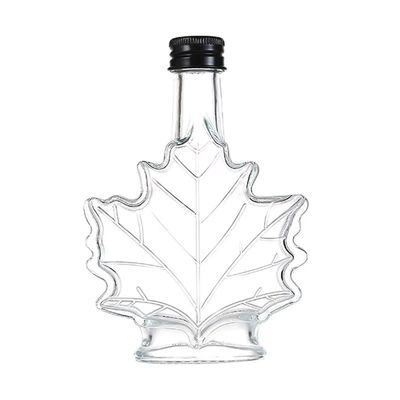 Botella de bebida de vidrio industrial de color personalizado con forma de hoja de arce 50 ml 100 ml 250 ml