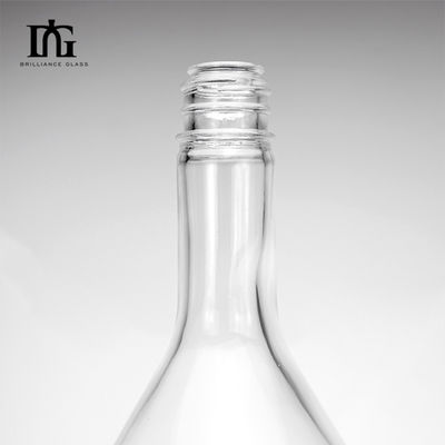 Botella de vidrio transparente de 1,75L con tapa de tornillo y grabado