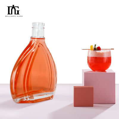 Botella redonda transparente de 700 ml de 750 ml de vidrio de vodka, whisky y ron con tapa de tornillo y muestra