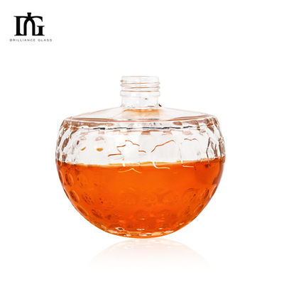Botella de vidrio transparente de diseño único de 700 ml con forma de cráneo única y corcho grabado