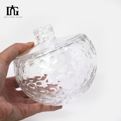 Botella de vidrio transparente de diseño único de 700 ml con forma de cráneo única y corcho grabado