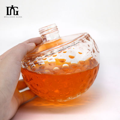 Botella de vidrio transparente de diseño único de 700 ml con forma de cráneo única y corcho grabado