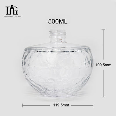 Botella de vidrio transparente de diseño único de 700 ml con forma de cráneo única y corcho grabado