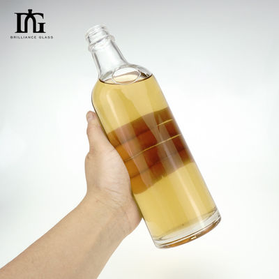 Logotipo del cliente aceptable Botella de vidrio personalizada de 550 ml para licores y bebidas con tapa de tornillo
