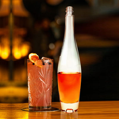 Se proporciona gratuitamente 550 ml de cuello largo vacío helado cristal claro botella de vino botella de champán