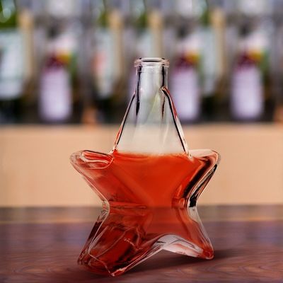 Contenedor de botellas de vidrio de 250 ml de grado alimenticio con tapa de tornillo de corcho en forma de estrella creativa